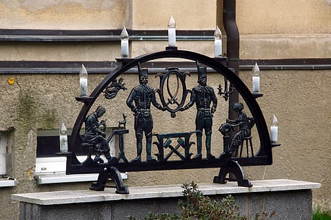 The Schwibbogen candle holder represents the arched entrance to a mine hung with guiding lights