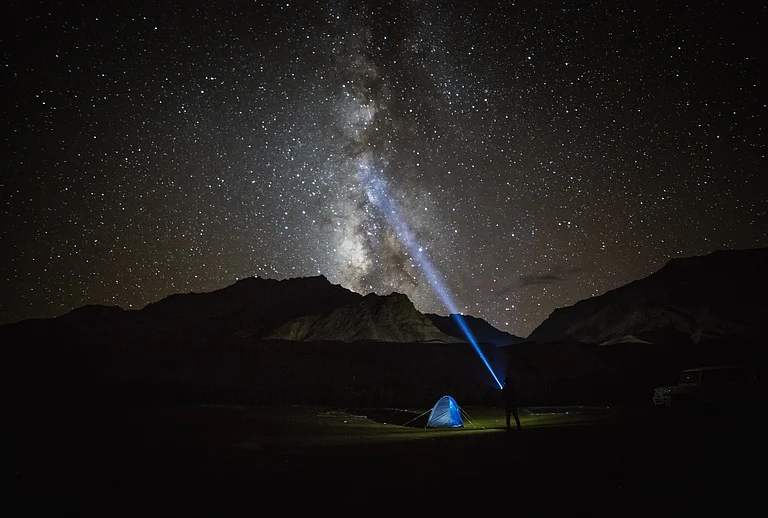 Milky way star shining above illuminated tents
- Shutterstock