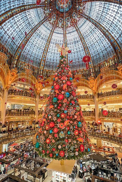 Christmas tree decoration with flowers inside Galeries Lafayette