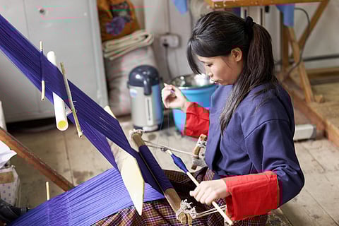 Visitors can watch artisans at work and even purchase handwoven textiles
