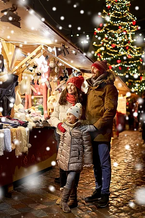 Shutterstock : A family enjoys their time at a Christmas town
