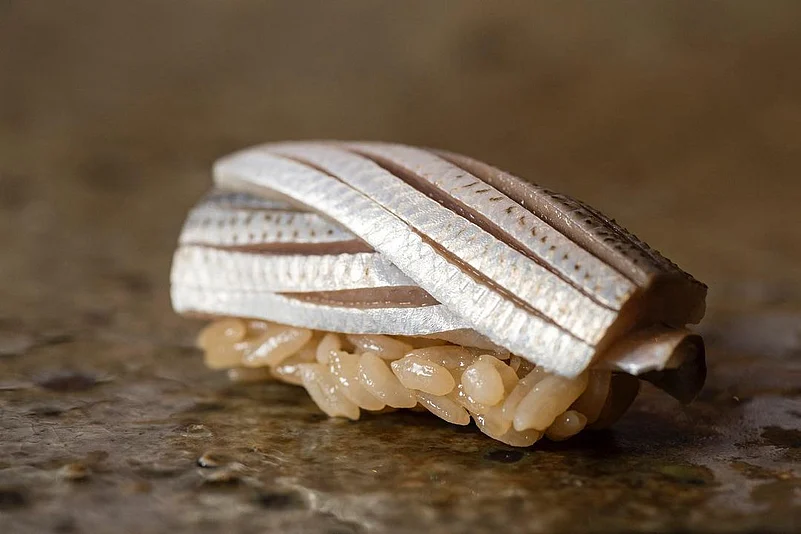 Silver/Shiny fish pickled in salt and later marinated in vinegar
.