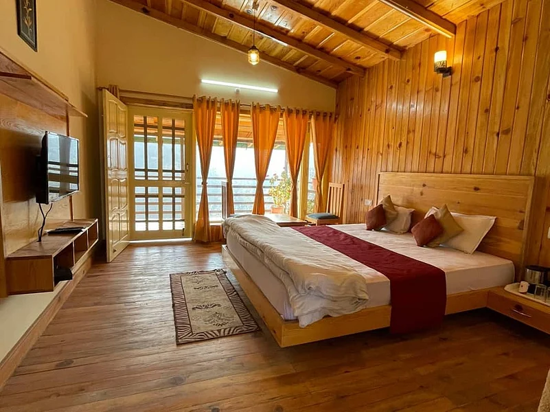 The Happy Homestays rooms here are insulated with wood and provide the perfect setting for relaxation
