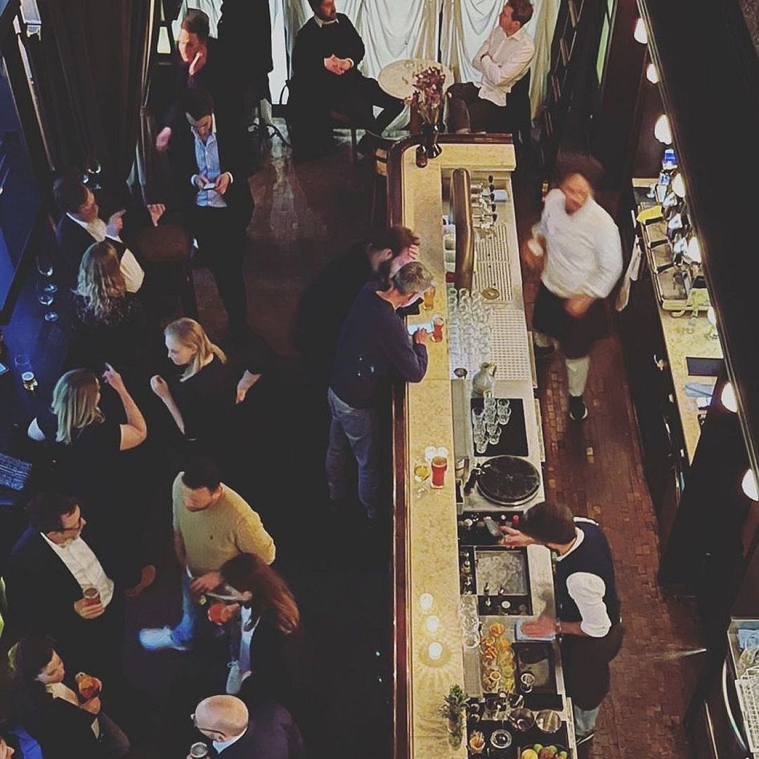 This bar transports you back to the Prohibition era with its inviting lighting and vintage decor