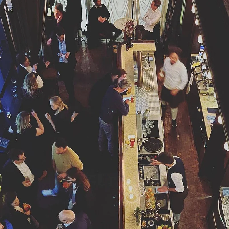 This bar transports you back to the Prohibition era with its inviting lighting and vintage decor