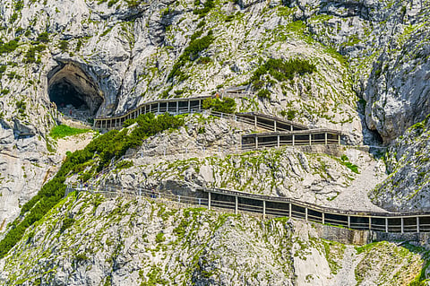 View of a zigzaging mountain road leading to the eisriesenwelt ice cave in Austria