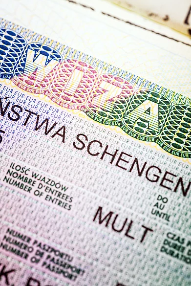Shutterstock : A fragment of European multi Schengen visa in passport
