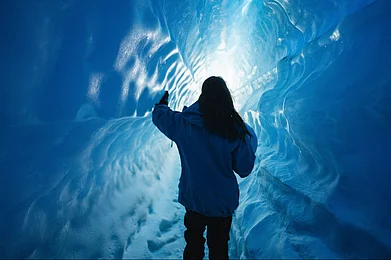 Copyright: White Desert : Early in the season during November to December, one of Antarctica’s hidden treasures reveals itself—the iridescent blue ice caves