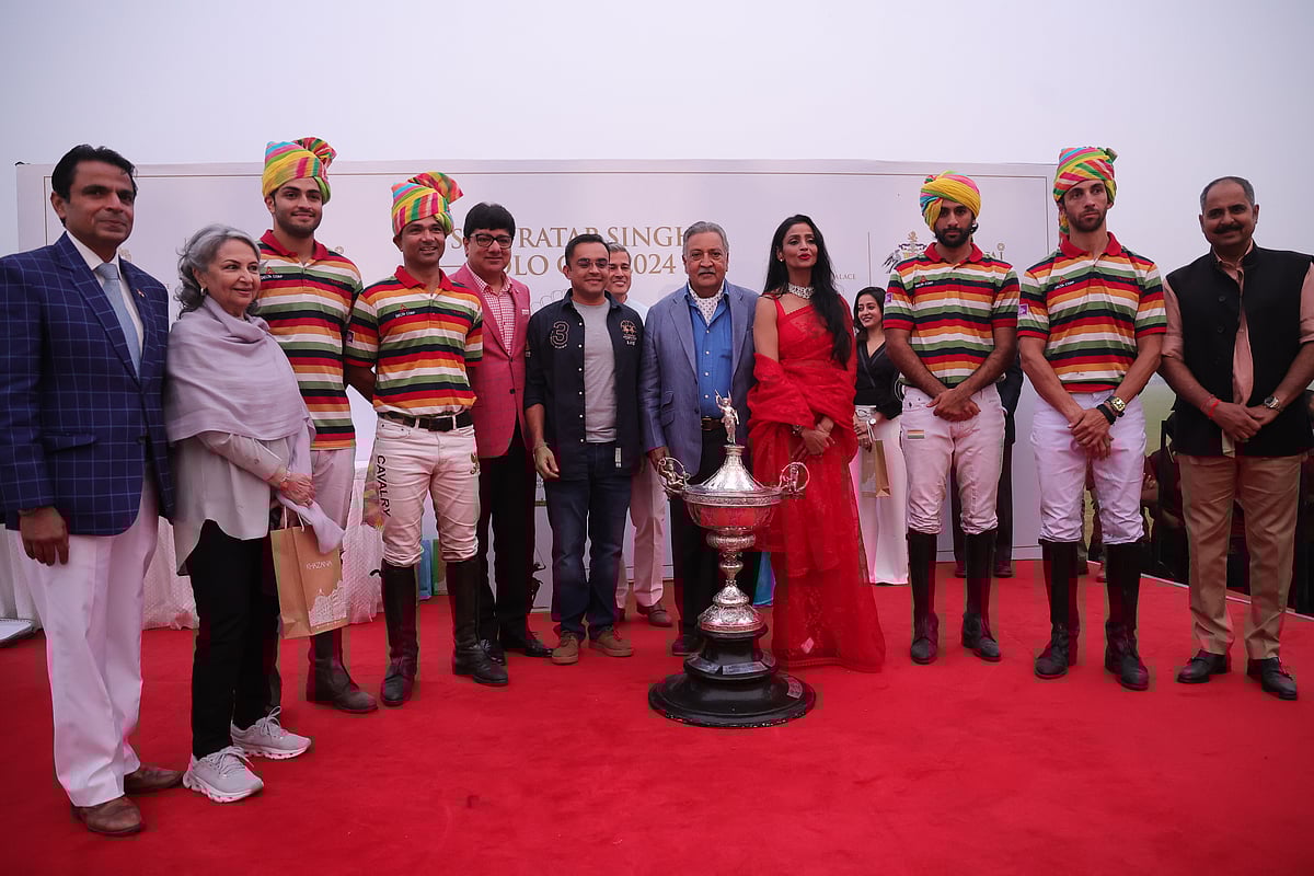 His Highness Maharaja Gajsingh II of Marwar-Jodhpur (left), Padma Bhushan awardee and actor Sharmila Tagore (second from left), and Puneet Chhatwal, the managing director and CEO of IHCL (in pink), stand with dignitaries and members of the winning team, Jaipur Delta, at the presentation ceremony for the Sir Pratap Singh Polo Cup 2024