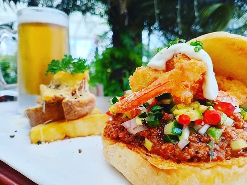 Special: Surf N Turf Burger (ground beef and shrimp salsa) served with cheesy wedges and a chilled draft