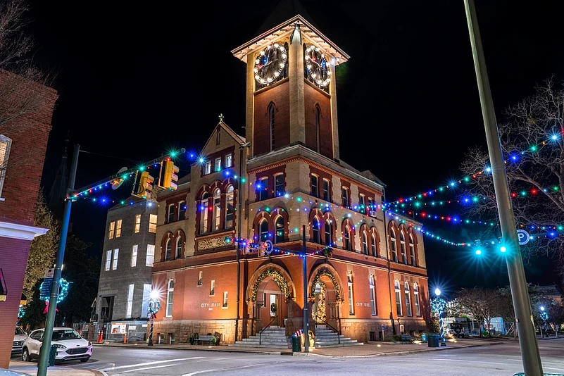 The City Hall building illuminated with Christmas lights