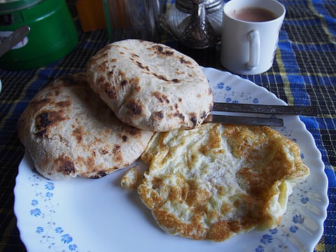 Khambir is a thick and round whole wheat bread that is often paired with butter tea