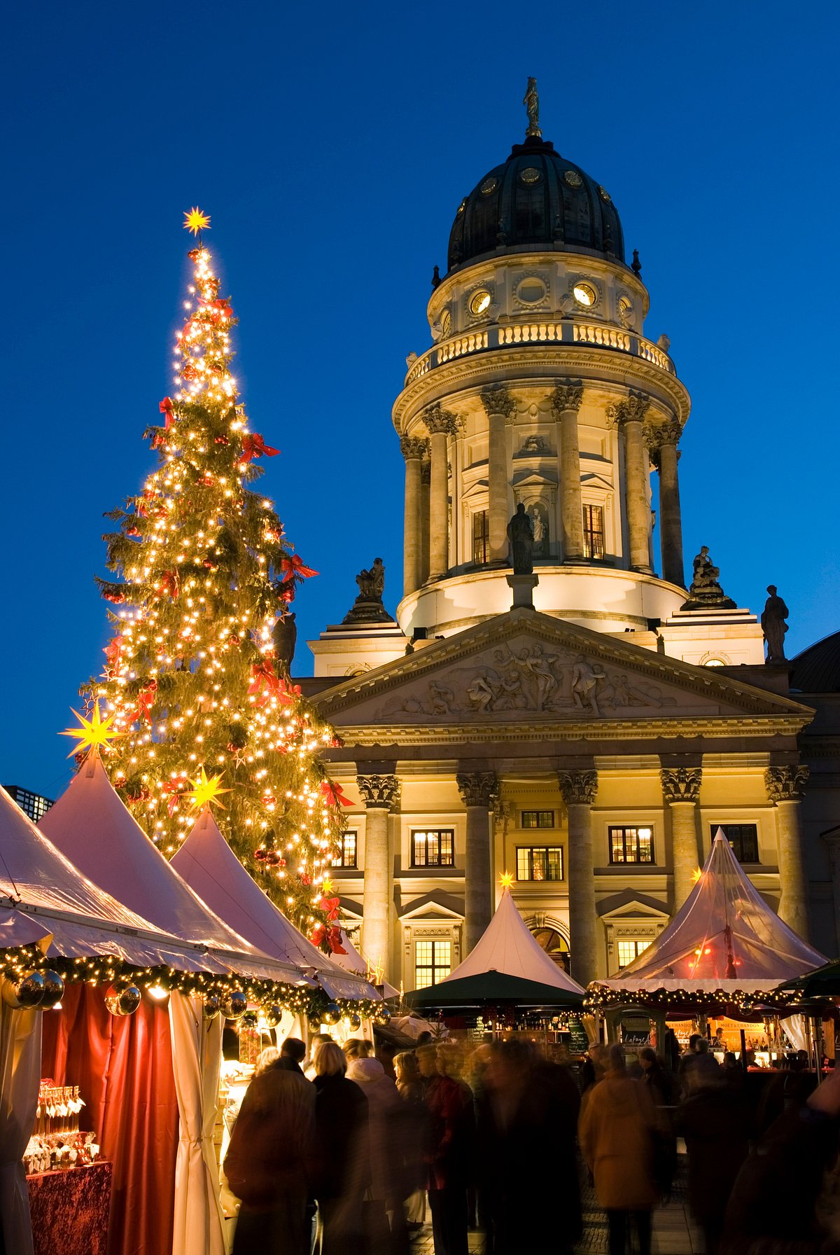 Shutterstock : Church with a view of Christmas market and decorations