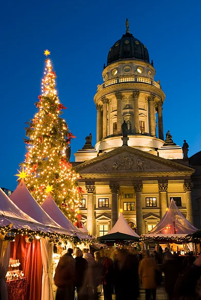 Shutterstock : Church with a view of Christmas market and decorations