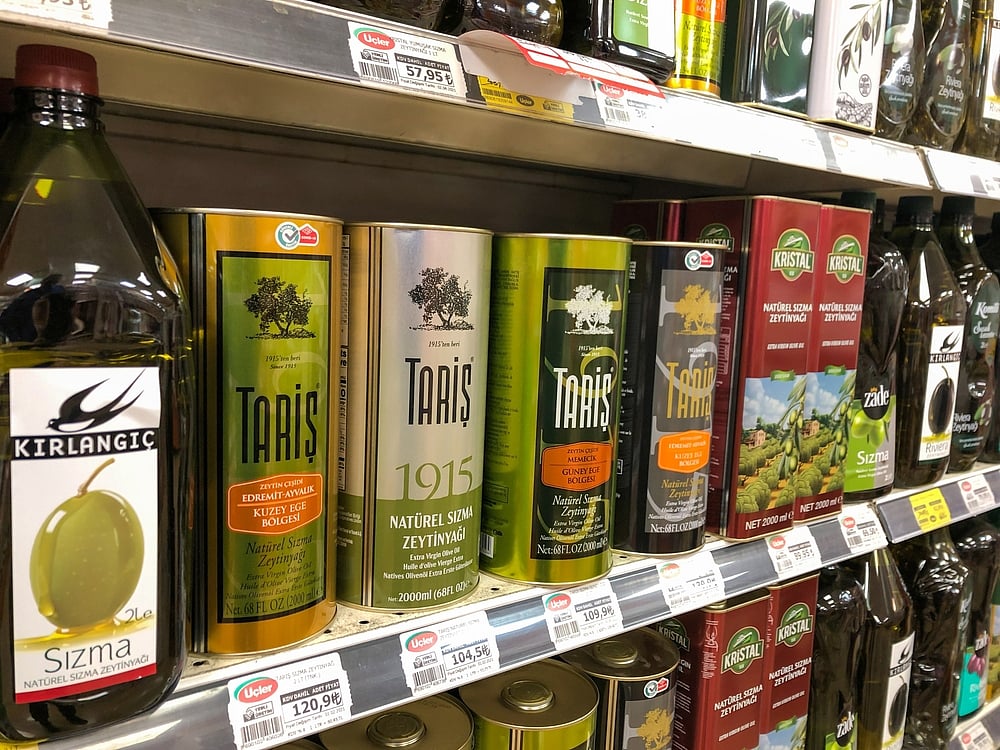 Variety of olive oil bottles on the shelf of a local supermarket in Istanbul