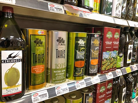 Variety of olive oil bottles on the shelf of a local supermarket in Istanbul