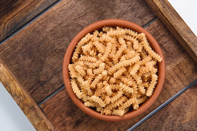 Murukku is a twisted fried snack made from rice and lentil dough