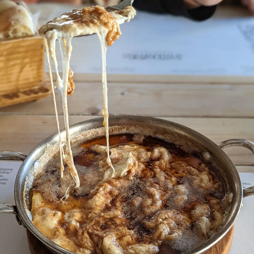 The traditional version of borano is cheese covered in hot melted butter, melting the cheese.