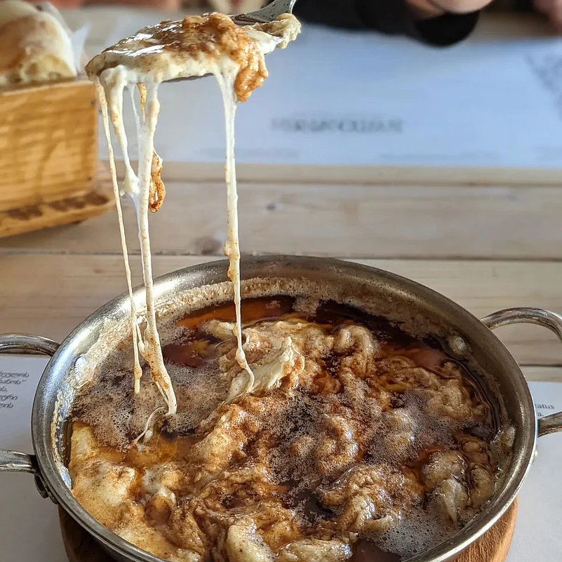 The traditional version of borano is cheese covered in hot melted butter, melting the cheese.