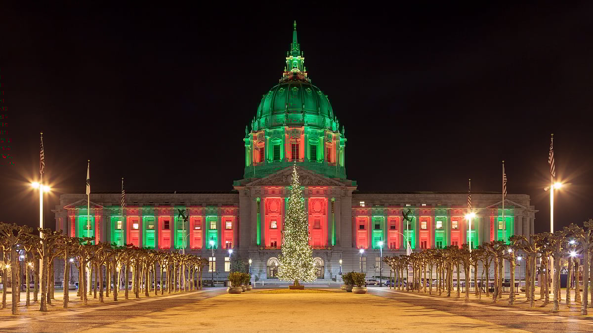 Panorama of San Francisco City Hall illuminated by Christmas lights.