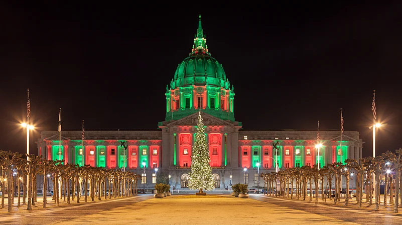 Panorama of San Francisco City Hall illuminated by Christmas lights.
