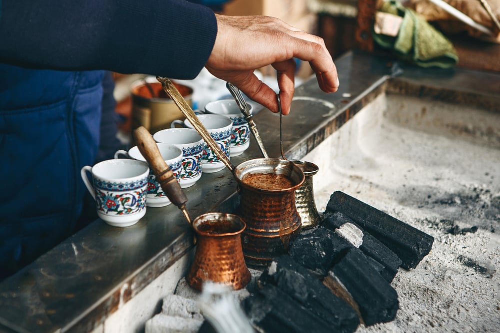 Cooking traditional Turkish coffee on charcoal