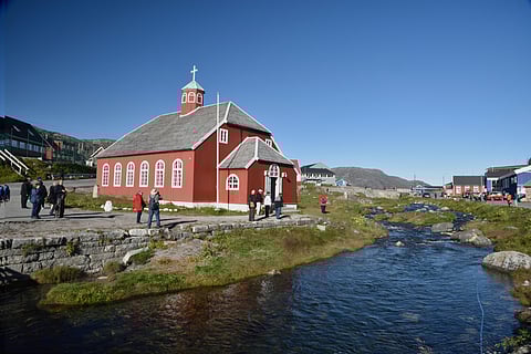 Visitors at the Church Of Our Savior Lutheran Church built in 1832 in Qaqortoq