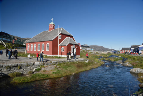 Visitors at the Church Of Our Savior Lutheran Church built in 1832 in Qaqortoq