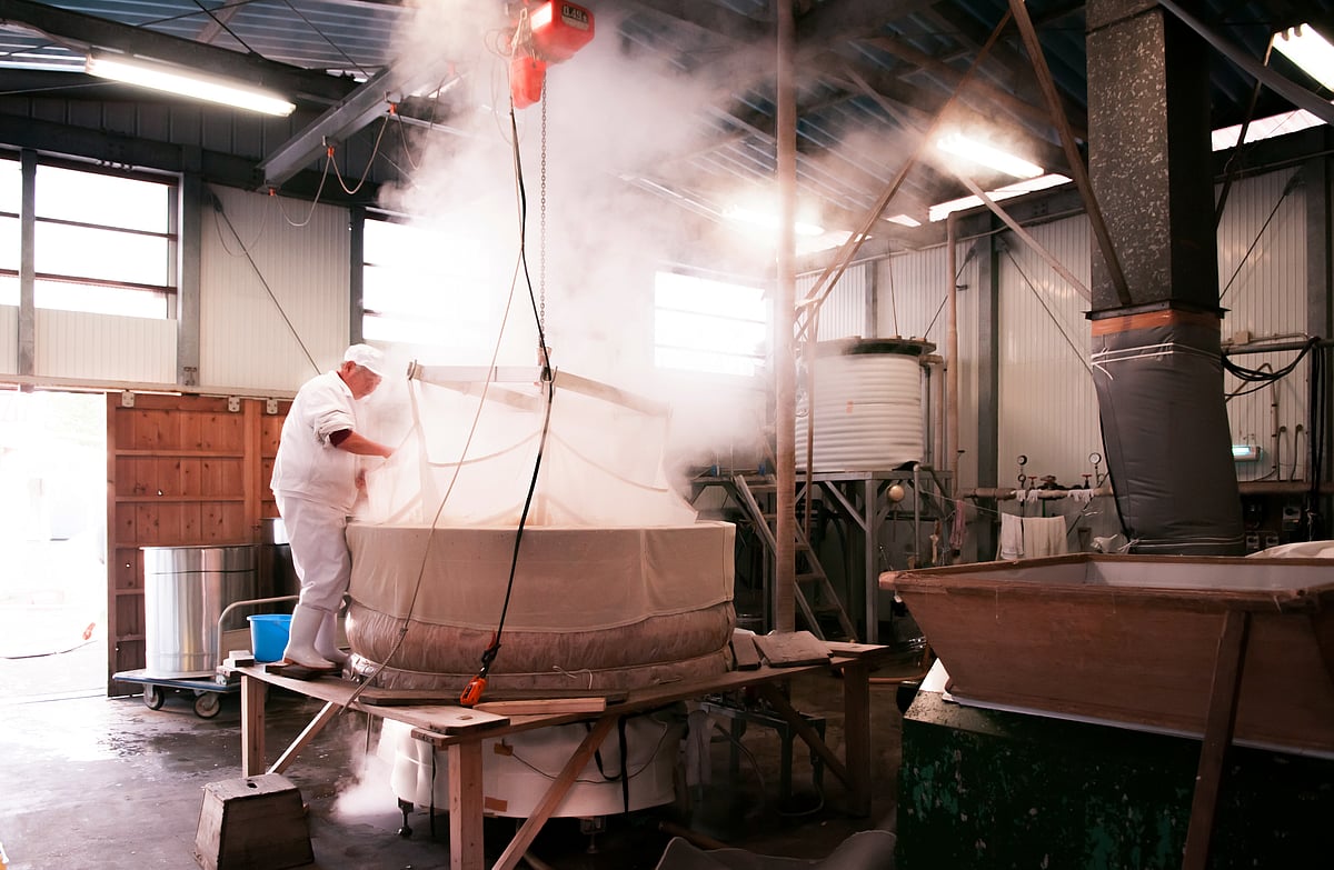 Rice steaming old fashion process of making Sake liqour in local vinatge brewery house