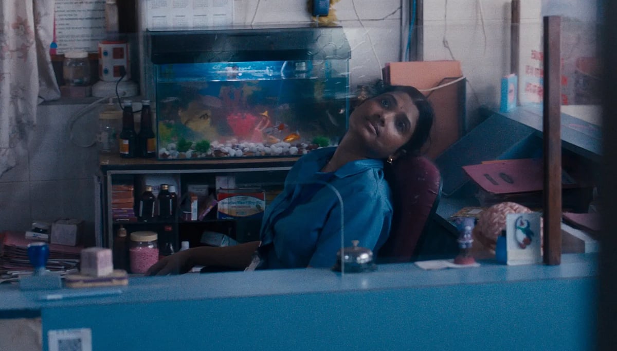 A stillshot of Anu daydreaming from All We Imagine As Light