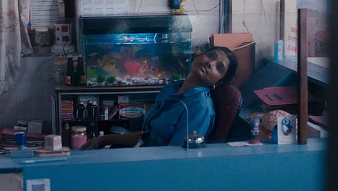 A stillshot of Anu daydreaming from "All We Imagine As Light"