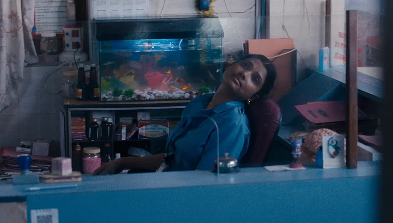 A stillshot of Anu daydreaming from All We Imagine As Light