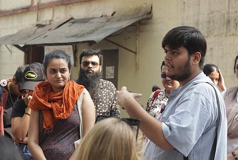 Payal Kapadia (right) and Eshaan Sharma (right) lead a walk across Mumbai, visiting sites important to the film and personal to director Payal Kapadia 