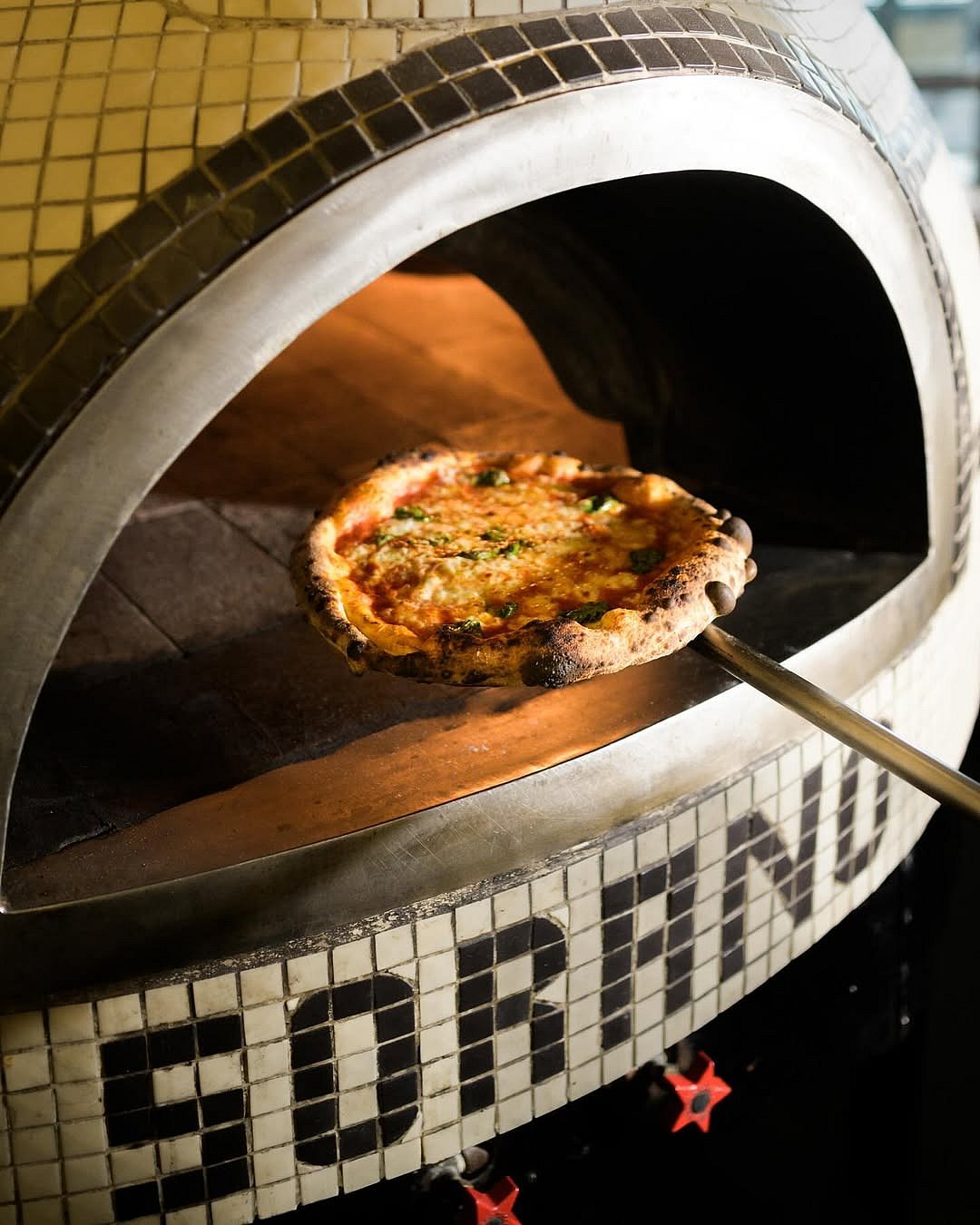 Their pizzas are made with hand-stretched dough, and have a smoky aroma created by an authentic brick oven