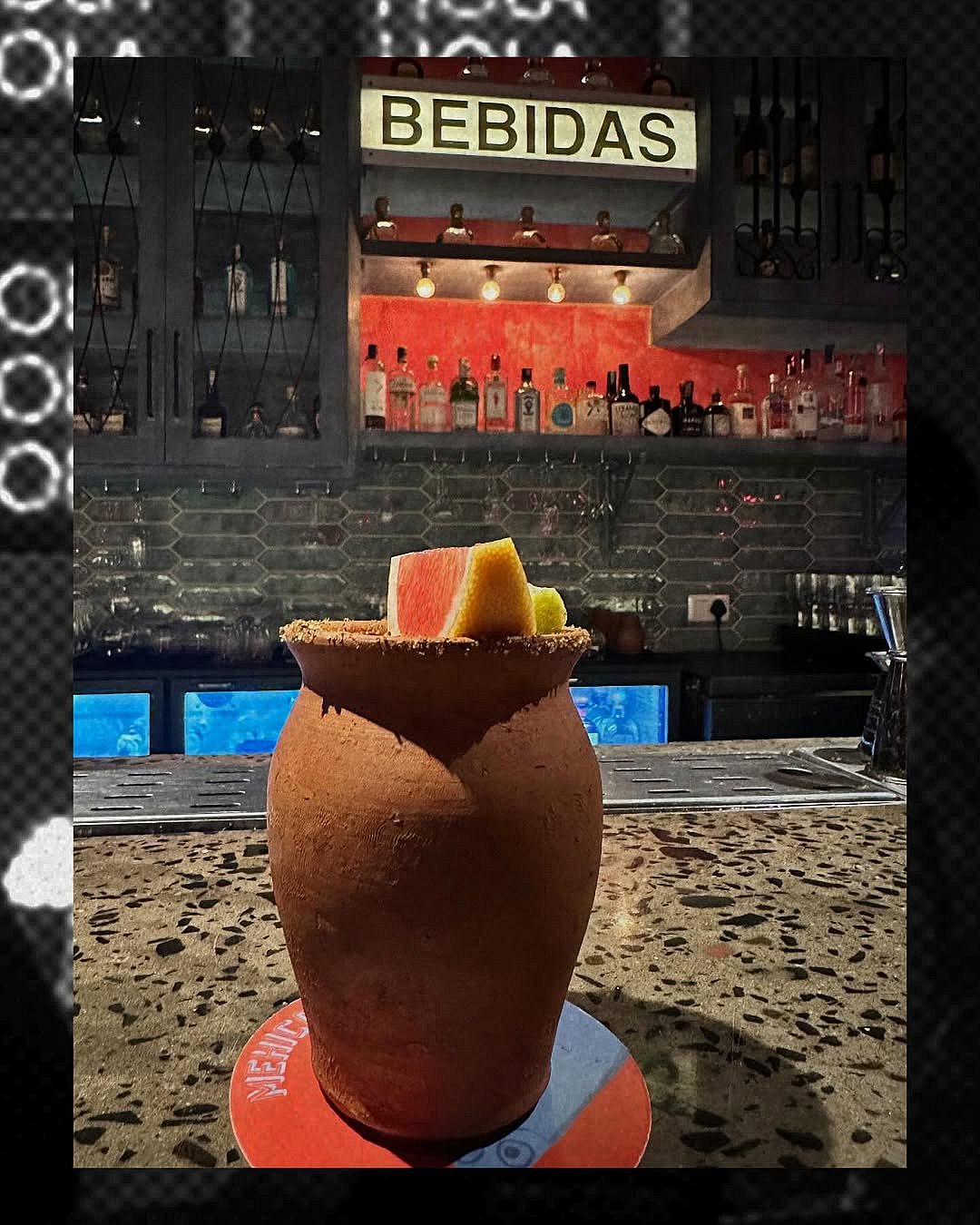 Cantarito, a traditional Mexican cocktail, is served in a clay cup