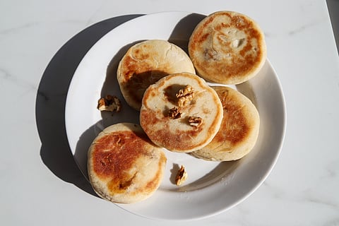 Hotteok are gooey pancakes filled with cinnamon and nuts
