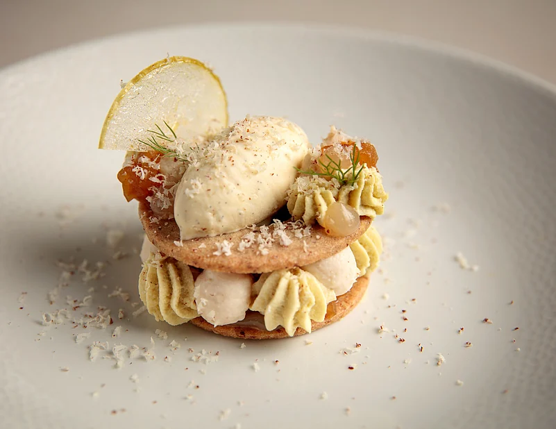 Fennel mousse with rich pecan nut namalaka, Madagascan vanilla bean ice cream and caramelized apple compote by Beyond Restaurant