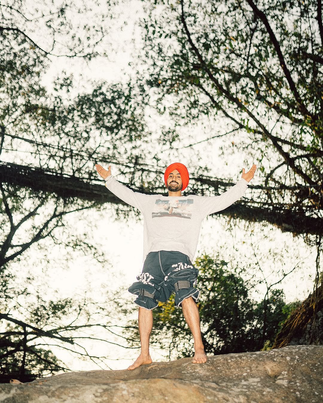 diljitdosanjh/instagram : Singer Diljit Dosanjh poses by the Root Bridges of Meghalaya