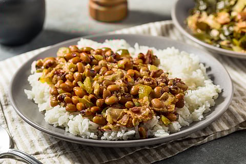 Hoppin' John is a dish of pork-flavoured field peas or black-eyed peas and rice, frequently served with collards or other cooked greens and cornbread