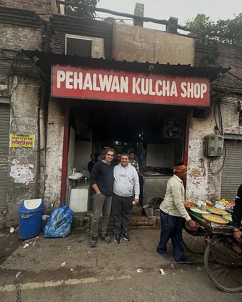 Imtiaz Ali poses with the owner at Pehalwan Kulcha Shop