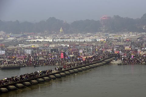 People wait to take a dip in the Triveni Sangam of Prayagraj