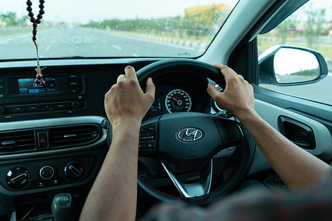 Avoid distractions like using your phone or adjusting the radio when driving 