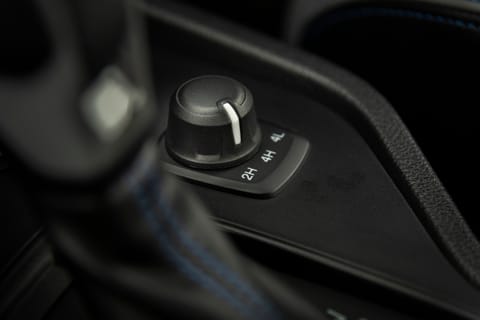 A car set to 2WD High Range (2H), the normal driving mode for a 4×4 vehicle