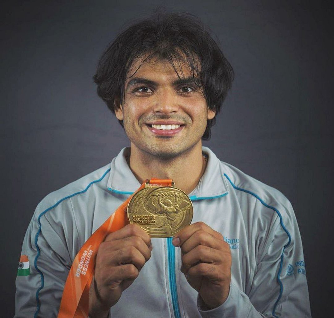 Neeraj Chopra poses with his Olympic medal