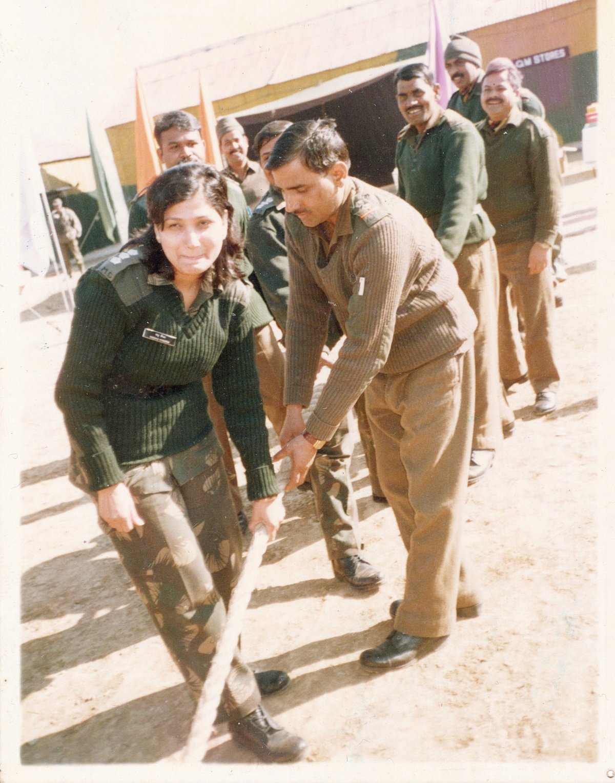 A fun moment with her colleagues playing tug of war