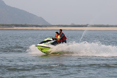 The author enjoying a jet ski ride on the Brahmaputra