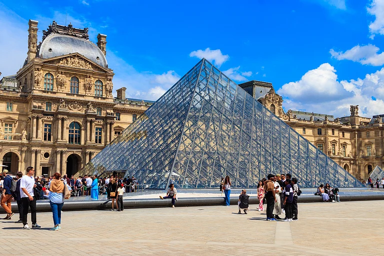 Exterior of the Louvre Museum in Paris - Shutterstock