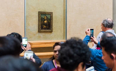 Shutterstock : The Mona Lisa by Italian artist Leonardo Da Vinci is housed in the Louvre Museum in Paris