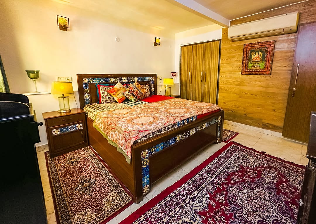 The elegantly appointed bedrooms feature artwork that enhances the ambience