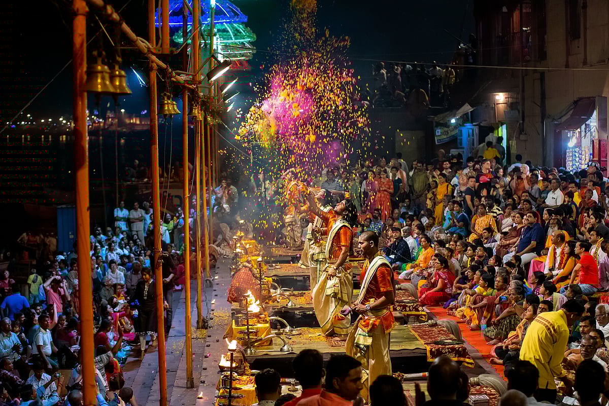 Hemachandra Jain/Shutterstock : Hindu priests perform the Ganga Aarti in Varanasi